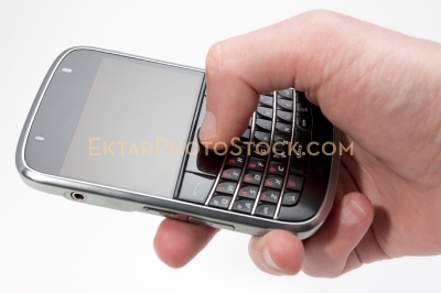 Smartphone isolated on white with one hand typing message