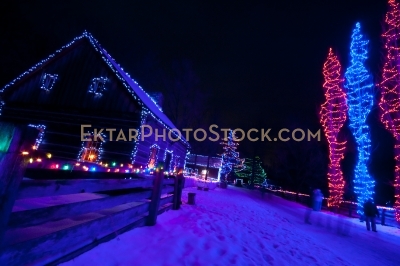 Street decorated with colorful Christmas lights blue
